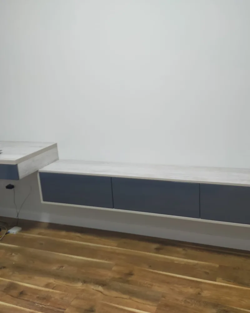 Built-in home office cabinetry with floating drawers and an integrated worktop