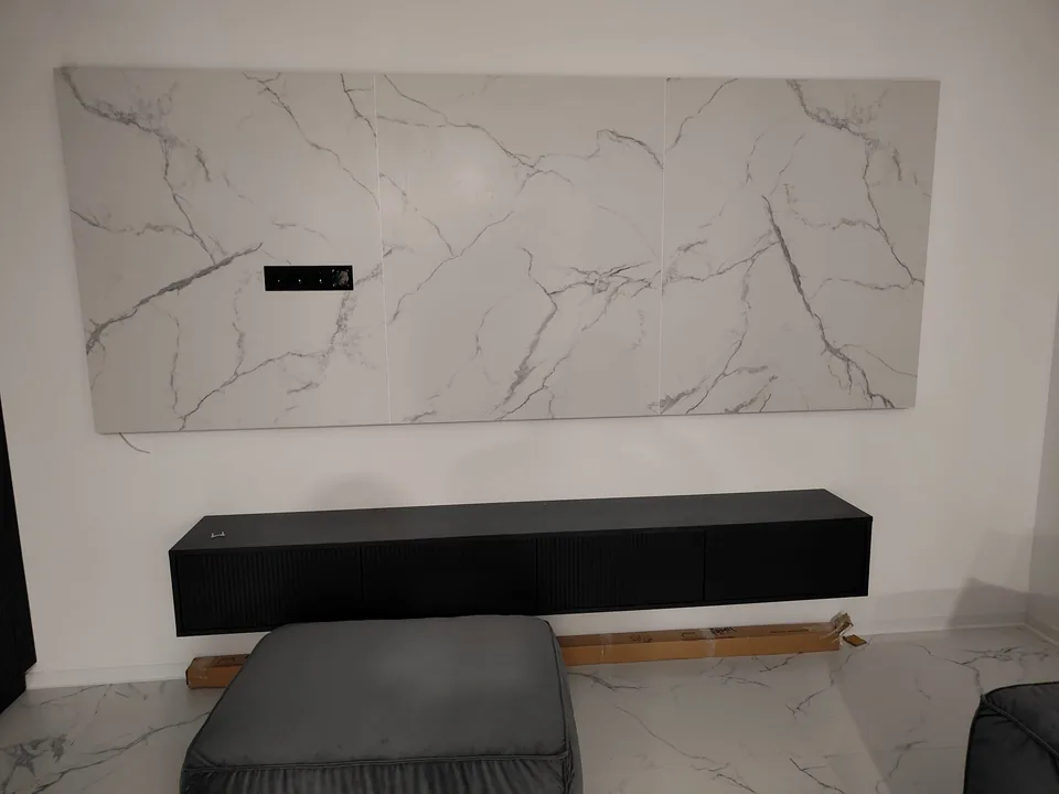 Marble-effect TV wall panel with a long black floating media cabinet
