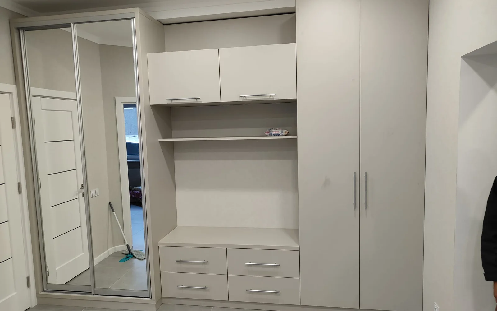 Made-to-measure fitted wardrobes with tailored storage and architectural detailing.