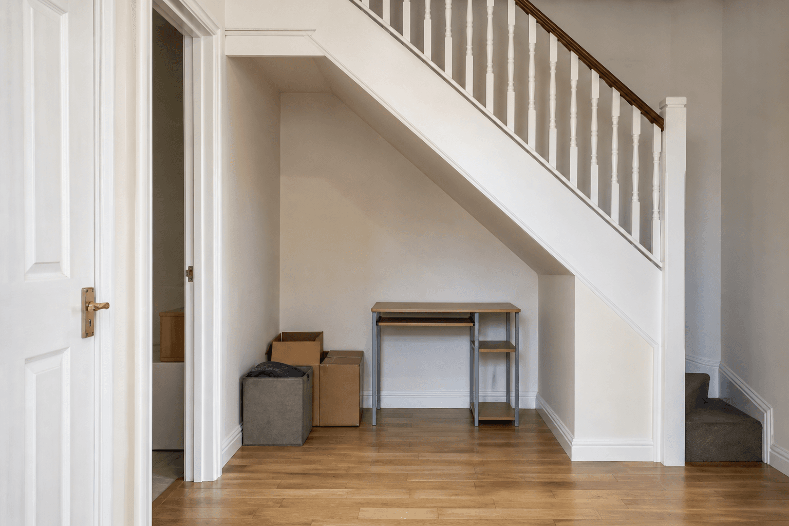 Underused under-stairs alcove before fitted furniture installation